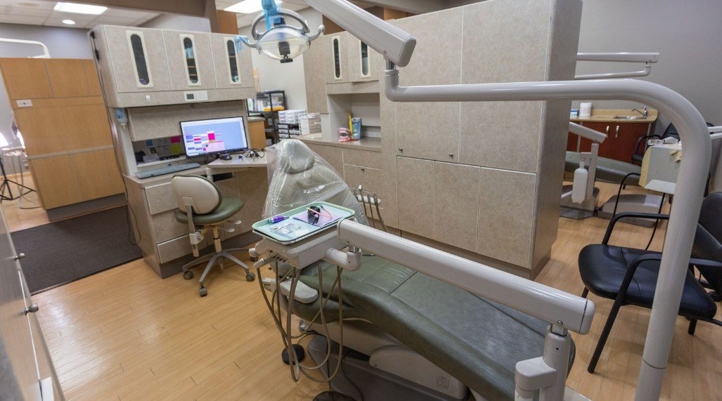 Dental treatment room with a world map on the wall