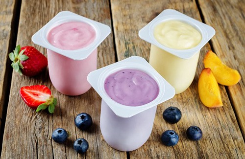 three cups of fruit-flavored yogurt