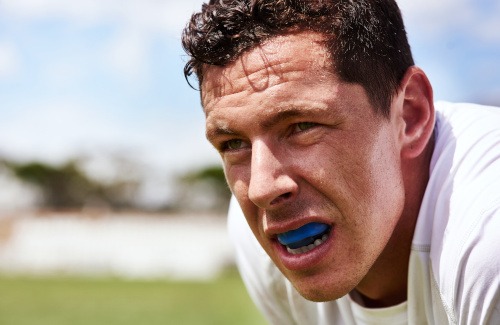 Closeup of man wearing mouthguard